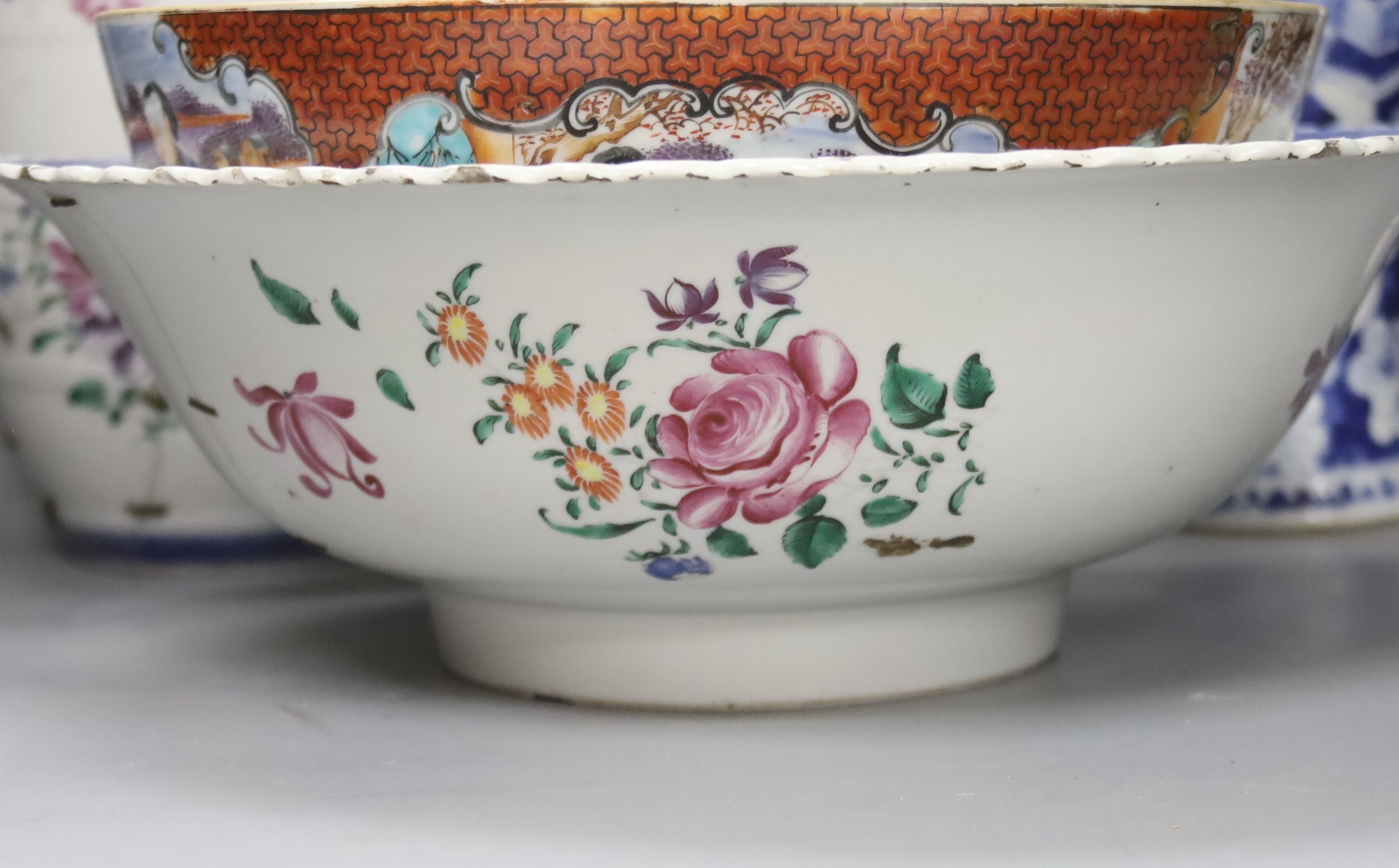 A Chinese Jiaqing export porcelain toilet jug and basin, a small punch bowl, and a blue and white vase (all a.f.) 31cm